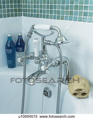 Stock Photography - Close-up of chrome tap and shower-head. Fotosearch