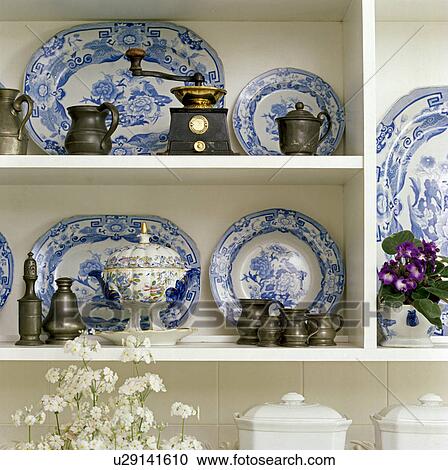 Stock Image - Close-up of collection of antique blue+white china. Fotosearch