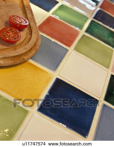 Picture - Close-up of colourful Fired Earth tiled worktop. Fotosearch