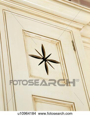 Picture - Close-up of cream kitchen cupboard. Fotosearch