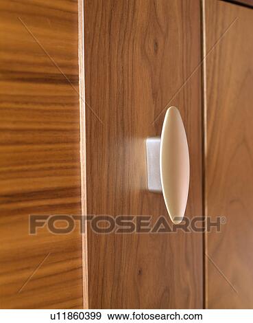 Stock Photo - Close-up of cupboard door and handle. Fotosearch