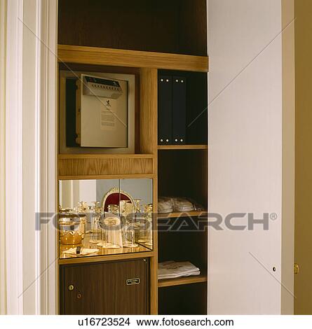 Close-up of cupboard with door open to reveal glasses on shelf View Large Photo Image Picture - Close-up of cupboard with door open to reveal glasses on shelf. Fotosearch
