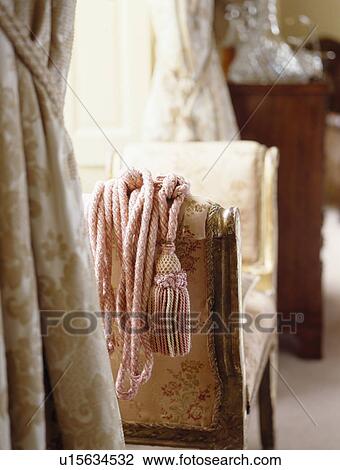 Close-up of curtain and chair View Large Photo Image Stock Image - Close-up of curtain and chair. Fotosearch