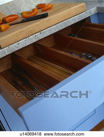 Close-up of cutlery in blue storage drawer View Large Photo Image Stock Photo - Close-up of cutlery in blue storage drawer. Fotosearch