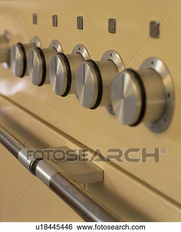 Stock Photograph - Close-up of dials on oven. Fotosearch
