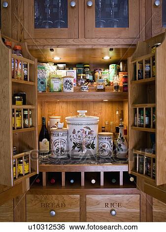 Close-up of doors open on larder cupboard with recessed lighting and pottery storage jars View Large Photo Image Stock Photograph - Close-up of doors open on larder cupboard with recessed lighting and pottery storage jars. Fotosearch