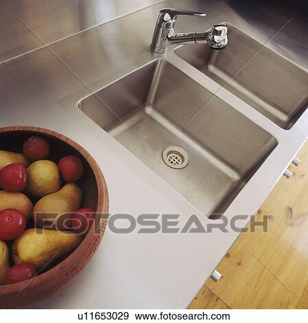 Stock Photo - Close-up of double stainless steel sinks. Fotosearch