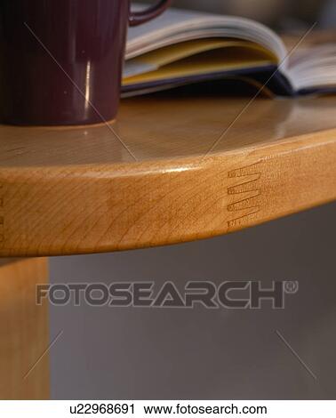 Stock Image - Close-up of edge of wooden table. Fotosearch