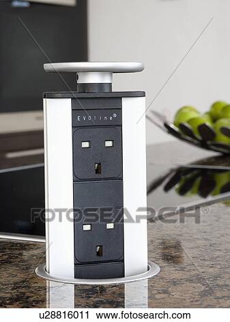 Stock Image - Close-up of Evoline pop-up socket. Fotosearch