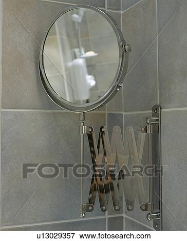 Stock Photo - Close-up of extending circular mirror. Fotosearch
