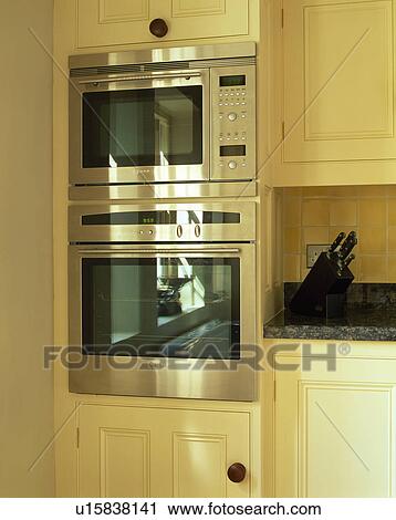 Close-up of eye-level Neff double oven in modern kitchen View Large Photo Image Stock Image - Close-up of eye-level Neff double oven in modern kitchen. Fotosearch