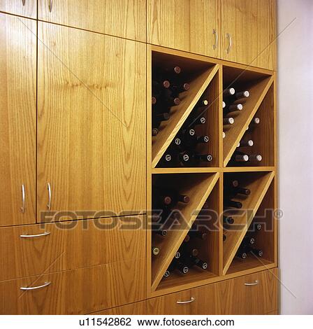 Close-up of fitted cupboard with wine storage View Large Photo Image Stock Image - Close-up of fitted cupboard with wine storage. Fotosearch