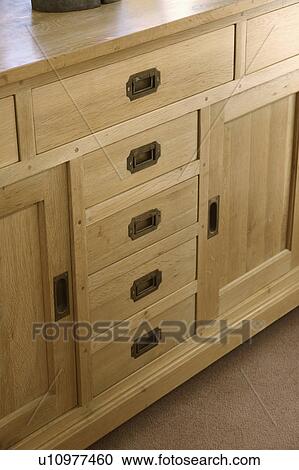 Close-up of fitted pale wood sideboard View Large Photo Image Stock Image - Close-up of fitted pale wood sideboard. Fotosearch