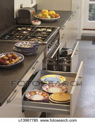 Close-up of fitted unit with drawers open to show plates View Large Photo Image Stock Photography - Close-up of fitted unit with drawers open to show plates. Fotosearch
