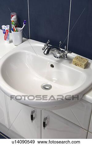Stock Photo - Close-up of fitted white basin. Fotosearch