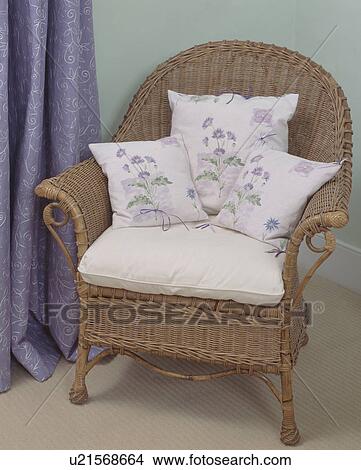 Close up of flower patterned cushions on wicker armchair View Large Photo Image Picture - Close up of flower patterned cushions on wicker armchair. Fotosearch