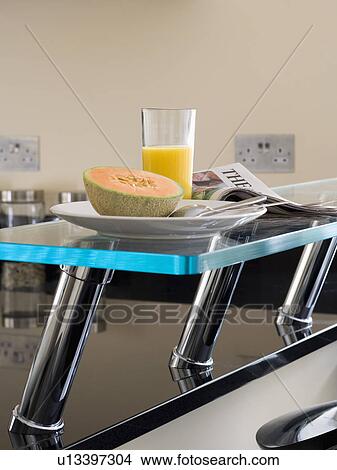 Close-up of fruit-juice and melon on breakfast bar View Large Photo Image Picture - Close-up of fruit-juice and melon on breakfast bar. Fotosearch