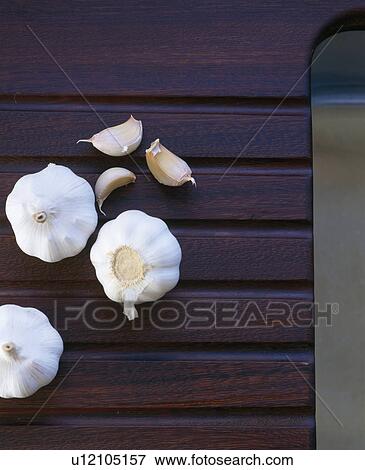 Close-up of garlic bulbs and cloves View Large Photo Image Stock Photo - Close-up of garlic bulbs and cloves. Fotosearch