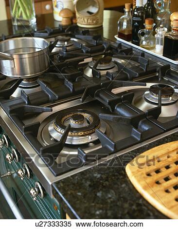 Stock Photography - Close-up of gas hob. Fotosearch