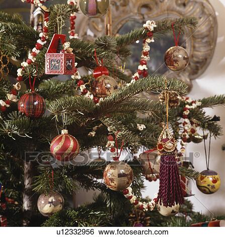 Close-up of glass baubles on Christmas tree View Large Photo Image Stock Photograph - Close-up of glass baubles on Christmas tree. Fotosearch