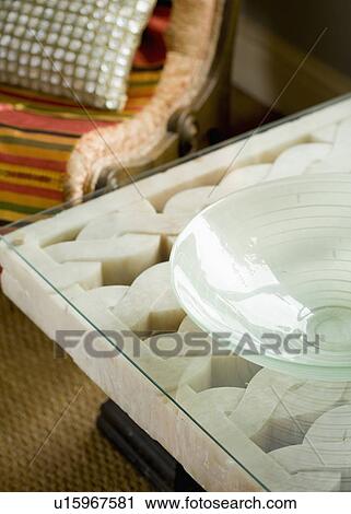 Close-up of glass bowl on glass-topped carved marble table View Large Photo Image Stock Image - Close-up of glass bowl on glass-topped carved marble table. Fotosearch