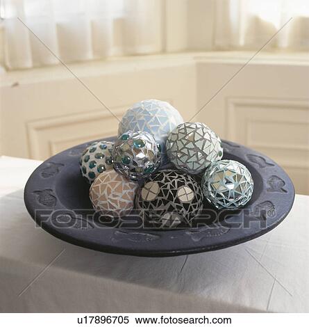 Stock Photography - Close-up of glass mosaic boules in grey bowl. Fotosearch