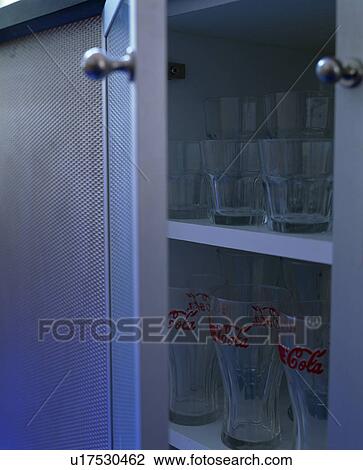 Close-up of glasses on cupboard shelves View Large Photo Image Stock Image - Close-up of glasses on cupboard shelves. Fotosearch