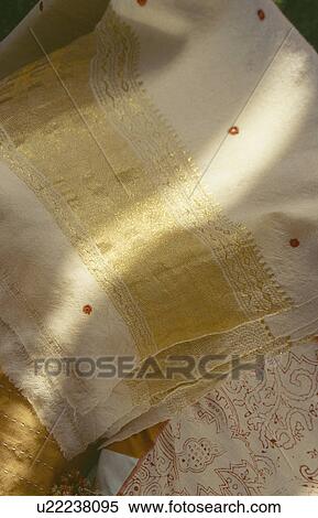 Stock Photography - Close-up of gold-embroidered Rajastani shawls. Fotosearch