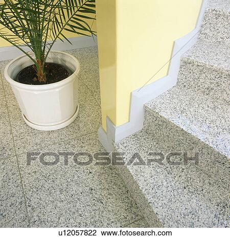 Stock Image - Close-up of granite floor tiles on stairs. Fotosearch