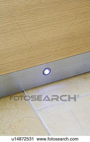 Stock Image - Close-up of halogen lighting on kick-board. Fotosearch