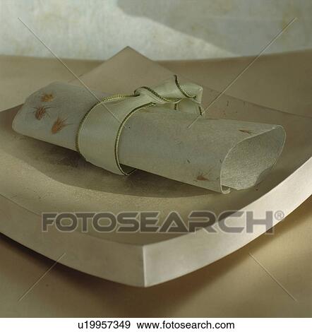 Close-up of hand-made paper napkin on square ceramic dish View Large Photo Image Stock Photo - Close-up of hand-made paper napkin on square ceramic dish. Fotosearch