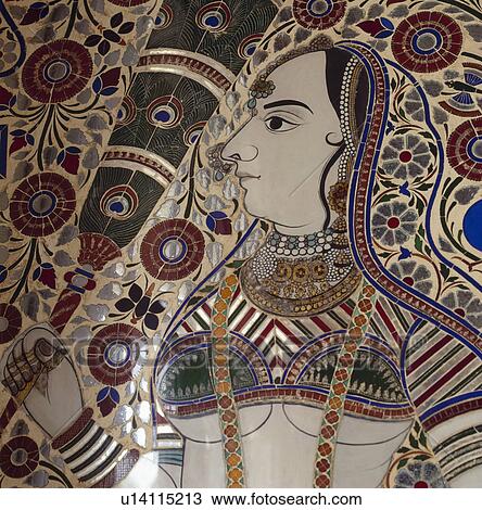 Stock Image - Close-up of intricately patterned mosaic tiled picture of 17th century Rajastani woman. Fotosearch
