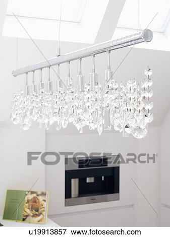 Stock Photo - Close-up of kitchen lighting with glass drops. Fotosearch