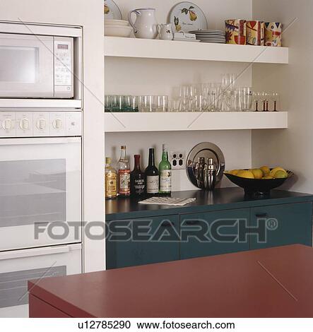 Stock Image - Close-up of kitchen shelves. Fotosearch