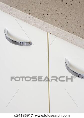 Close-up of kitchen storage cupboard with metal handles View Large Photo Image Stock Photo - Close-up of kitchen storage cupboard with metal handles. Fotosearch