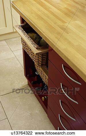 Stock Image - Close-up of kitchen unit with storage baskets. Fotosearch