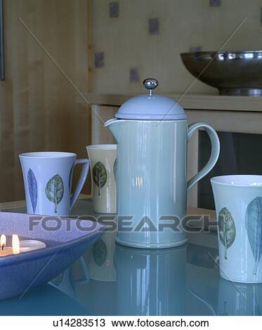 Close-up of leaf-patterned cups with pale blue ceramic coffeepot View Large Photo Image Stock Image - Close-up of leaf-patterned cups with pale blue ceramic coffeepot. Fotosearch