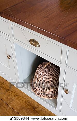 Close-up of lidded basket in modern kitchen unit View Large Photo Image Picture - Close-up of lidded basket in modern kitchen unit. Fotosearch