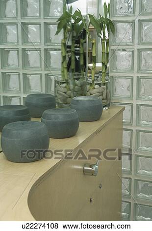 Close-up of lidded pots and glass brick wall View Large Photo Image Stock Photo - Close-up of lidded pots and glass brick wall. Fotosearch