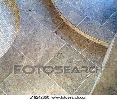 Stock Image - Close-up of limestone tiled floor. Fotosearch