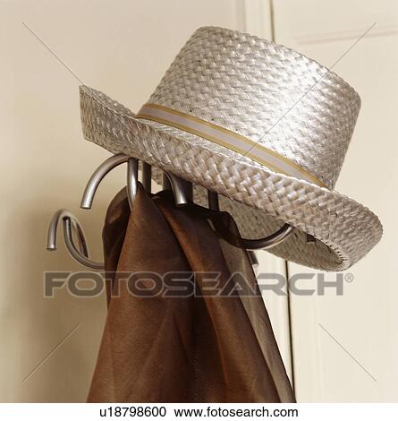 Close-up of man's metallic straw hat on hat-stand View Large Photo Image Stock Image - Close-up of man's metallic straw hat on hat-stand. Fotosearch