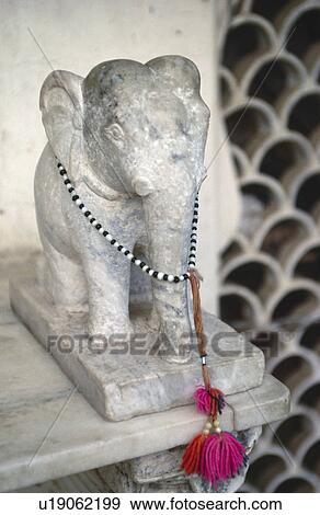 Stock Photo - Close-up of marble statue of Indian elephant. Fotosearch