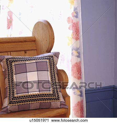 Close-up of mauve checked cushion on wooden settle View Large Photo Image Stock Image - Close-up of mauve checked cushion on wooden settle. Fotosearch
