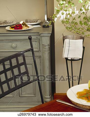 Stock Image - Close-up of metal dining chair. Fotosearch