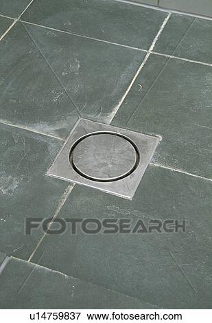 Close-up of metal drain in tiled floor View Large Photo Image Stock Photo - Close-up of metal drain in tiled floor. Fotosearch