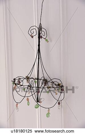 Stock Photography - Close-up of metal ornament decorated with glass beads. Fotosearch