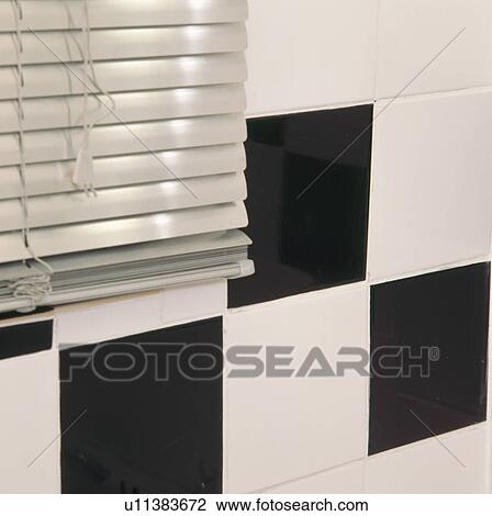 Close-up of metallic blind and black+white wall tiles View Large Photo Image Stock Image - Close-up of metallic blind and black+white wall tiles. Fotosearch