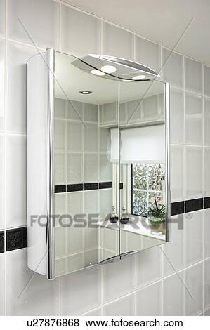 Stock Photo - Close-up of mirrored bathroom cabinet. Fotosearch