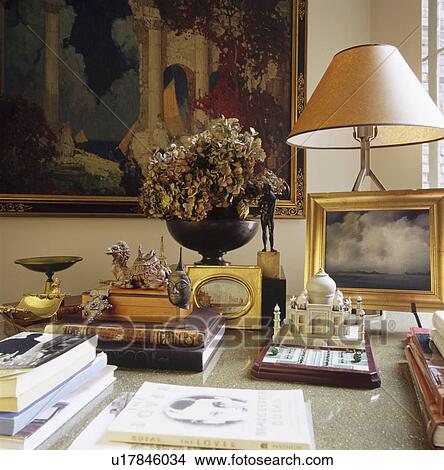 close-up of model of Taj Mahal and gold framed picture with dried flowers and cream lamp with books View Large Photo Image Picture - close-up of model of Taj Mahal and gold framed picture with dried flowers and cream lamp with books. Fotosearch