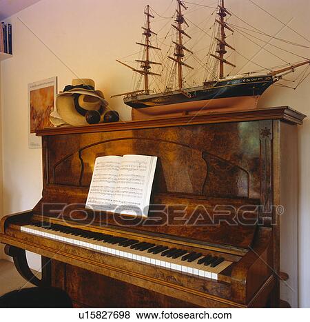 Stock Photo - Close-up of model ship on piano. Fotosearch